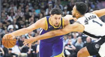  ??  ?? Klay Thompson beats the long reach of Kyle Anderson on a second-half drive. Thompson finished 8-for-16 from the field, including 3-for-6 from beyond the three-point arc.