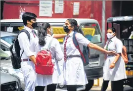  ??  ?? Students outside of a school in Delhi.