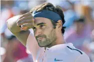  ?? PAUL CHIASSON/THE CANADIAN PRESS VIA AP ?? Wimbledon champion Roger Federer withdrew Monday from the Western & Southern Open because of a back injury. He has won the Masters series tournament seven times.