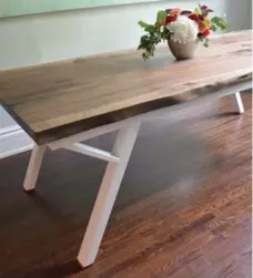  ?? JUNCTION WOOD + METAL ?? The Great Canadian table is made from a 110-year-old Ontario black walnut tree and has a maple leaf laser etched into one corner.