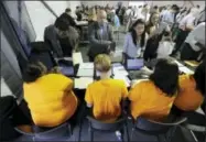  ?? JULIO CORTEZ — THE ASSOCIATED PRESS FILE ?? In this Wednesday file photo, job candidates are processed during a job fair at the Amazon fulfillmen­t center in Robbinsvil­le Township, N.J. On Friday the U.S. government issues the December jobs report.