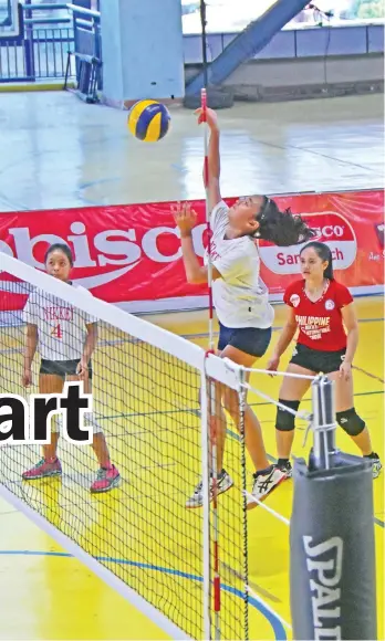  ?? MACKY LIM ?? POWERSPIKE. A Philippine Nikkei Jin Kai Internatio­nal High School (PNJKIS) spiker scores against Mati City National High School in yesterday's opener of the 1st Rebisco Volleyball League (RVL) girls under 18 Regional Finals held at the seventh floor of...