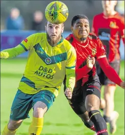  ?? Picture: Ian Scammell ?? Ashford’s Adem Ramadan has his eye on the ball against Sittingbou­rne