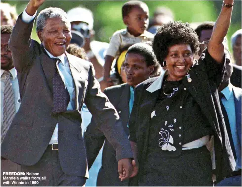  ??  ?? FREEDOM: Nelson Mandela walks from jail with Winnie in 1990