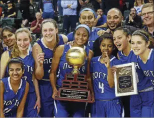  ?? GREGG SLABODA — TRENTONIAN PHOTO ?? West Windsor-Plainsboro North girls basketball players celebrate winning the Mercer County Tournament over Ewing.