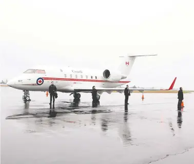  ?? CHAD HIPOLITO/THE CANADIAN PRESS ?? Prime Minister Stephen Harper’s security staff looks over the Challenger jet in North Saanich, B.C., in early 2014.
Several of the jets might soon be unable to meet foreign standards for navigation systems.