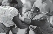  ?? [AP PHOTO] ?? Tampa Bay Buccaneers defensive tackle Gerald McCoy, right, works against offensive tackle Caleb Benenoch during an NFL football training camp practice on July 28. McCoy, the former Oklahoma standout, is entering his ninth season in the NFL.