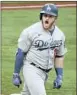  ?? Robert Gauthier L. A. Times ?? MAX MUNCY roars in celebratio­n after his f irst- inning homer.