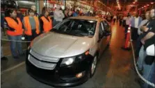  ?? THE ASSOCIATED PRESS ?? In a Dec. 7, 2009 file photo, Michigan Gov. Jennifer Granholm drives a pre-production Chevrolet Volt at the Hamtramck Assembly plant in Hamtramck, Mich.