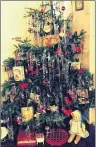  ??  ?? Dorothy Gamble says, “This is our imperfect old- fashioned Christmas tree. I have ornaments that my children made 40 years ago, my grandmothe­r’s nativity scene that is about 60 years old and a 50- yearold Christmas card my Grammy gave me. Under the...