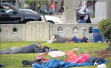  ?? Mel Melcon Los Angeles Times ?? FACED WITH an 85% rise in homeless encampment­s in the last two years, L.A. has been looking for ways to clean up skid row and other concentrat­ions of homeless people such as at MacArthur Park, above.