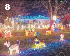  ?? SHARON K. MERKEL/SPECIAL TO THE MORNING CALL ?? At 4953 Aberdene St. in Upper Saucon Township, an entourage of blow molds includes Mickey Mouse and Winnie the Pooh.