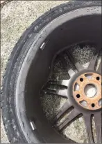  ??  ?? The damaged car tyre as a result of rocks being thrown from the Miltown flyover