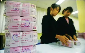  ?? AFP ?? Thailand is an important source of foreign currency for Myanmar, sent in remittance­s by migrant workers employed there.