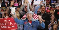  ?? — AP ?? DENVER: Supporters of Republican presidenti­al candidate, Donald Trump, cheer as he arrives to speak during a campaign rally.