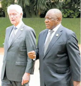  ?? AP ?? Former US President Bill Clinton (left) and South Africa’s President Cyril Ramaphosa arrive to lay a wreath at a ceremony to mark the 30th anniversar­y of the Rwandan genocide, held at the Kigali Genocide Memorial, in Kigali, Rwanda.