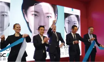  ??  ?? Jean-Paul Agon, Chairman and CEO of the L’Oréal Group (third from left) and Fabrice Megarbane, President and CEO of L’Oréal China (first from right) at La Roche-Posay’s Effaclar Spotscan launch ceremony on Viva Tech