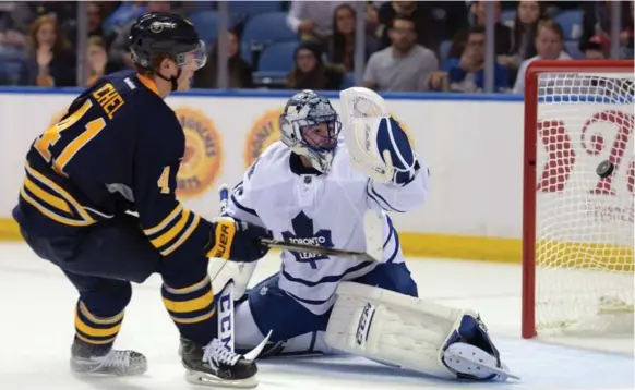 ?? GARY WIEPERT/THE ASSOCIATED PRESS ?? Buffalo Sabres rookie centre Jack Eichel scores his first goal of the pre-season, on a short-handed breakaway to boot, on Leafs goalie Jonathan Bernier Tuesday night.