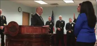  ?? MICHAEL GWIZDALA- DIGITAL FIRST MEDIA ?? Timothy Dennin is sworn in as a Troy police officer.