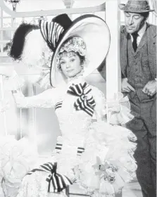  ??  ?? Who was the fairest of them all? Audrey Hepburn makes a spectacle of herself with Rex Harrison at the horse track in My Fair Lady.