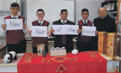  ??  ?? St Margaret College Senior Secondary School, Verdala, Cospicua students: Melvin Vella, Jordan Abela, Kurt Scerri and Thomas Borg accompanie­d by Science teacher Martin Azzopardi sdc wishing a Happy New Year of the Rooster to all the Chinese people in...