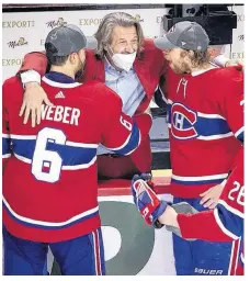  ?? POSTMEDIA NEWS ?? Montreal Canadiens general manager Marc Bergevin congratula­tes defenceman Shea Weber, centre Eric Staal and defenceman Jeff Petry after the Canadiens defeated the Vegas Knights to advance to the Stanley Cup final last Thursday.