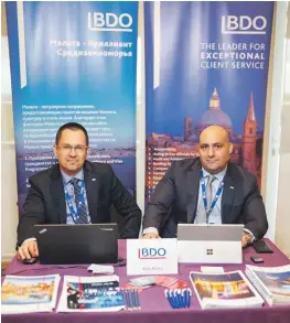  ??  ?? Sam Spiridonov and Mark Attard at the BDO Malta stand at INTAX Ukraine