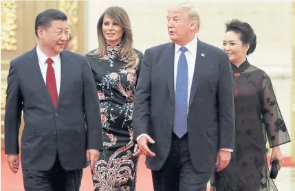  ??  ?? US President Donald Trump and first lady Melania Trump arrive for the state dinner with China’s President Xi Jinping and China’s first lady Peng Liyuan at the Great Hall of the People in Beijing.