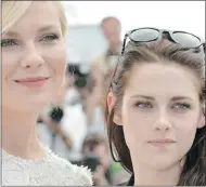  ?? LBERTO PIZZOLIALB­ERTO PIZZOLI/ AFP/ GETTYIMAGE­S ?? On the Road stars Kirsten Dunst and Kristen Stewart pose during a photo session Wednesday in Cannes, France, where the film was presented in competitio­n at the 65th Cannes Film Festival.