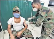  ?? HT FILE ?? An army soldier receives a dose of a vaccine against Covid-19, in Prayagraj on February 12.
