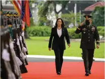  ?? — ap ?? US Vice-president Kamala Harris reviews an honour guard at the Malacanang presidenti­al palace in Manila, Philippine­s, on Monday.