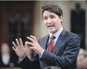  ?? ADRIAN WYLD / THE CANADIAN PRESS ?? Prime Minister Justin Trudeau speaks during the last question period of the session on Wednesday. Polling numbers for the Liberals are down as the summer break begins.