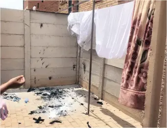  ??  ?? AMANDA Ngubombini reached an impasse with her neighbours after two boys set fire to the washing line – filled with laundry – in December. Her white linen and new outfits were destroyed.