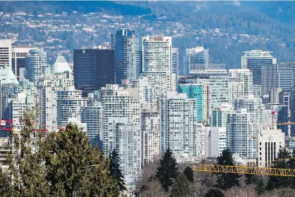  ?? DARRYL DYCK/THE CANADIAN PRESS ?? There are about 600,000 condominiu­m units in Metro Vancouver, with about 150,000 of those in the city of Vancouver, which saw its first condo complex built 50 years ago and a stream of taller, more tightly packed towers since.