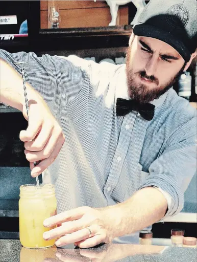  ?? KRISTINA INMAN
SPECIAL TO THE ST. CATHARINES STANDARD ?? Zac Kvas, a mixologist at Wayne Gretzky Estates Winery & Distillery, which opened under the Andrew Peller umbrella a year ago, formulates a custom cocktail. A selection of some of the new releases from DIllon’s Distillery, including the Professor’s...