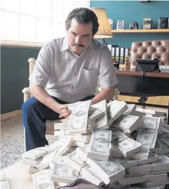  ?? Daniel Daza Netflix ?? “NARCOS” on Netflix features Wagner Moura playing cartel kingpin Pablo Escobar in a show made vibrant by the performanc­es and attention to detail.