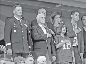  ?? THE ASSOCIATED PRESS ?? Vice President Mike Pence, front center, stands Sunday during the playing of the national anthem before an NFL football game between the Indianapol­is Colts and the San Francisco 49ers in Indianapol­is.