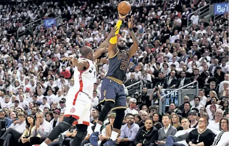  ?? FRANK GUNN/THE CANADIAN PRESS ?? Cleveland Cavaliers forward LeBron James shoots over Toronto Raptors forward Serge Ibaka during the second half of game three of an NBA playoff series basketball game in Toronto on Friday.