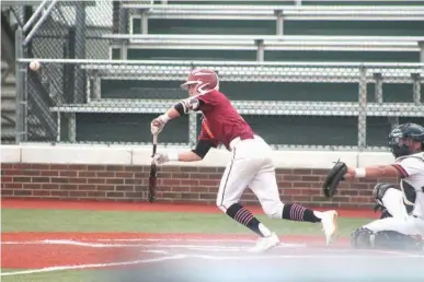  ?? Photo by Erik Holth ?? n Texarkana Razorbacks’ Riley Orr bunts for a base hit in the first inning against Fort Smith on Sunday in the American Legion Arkansas State Tournament in Conway. The Razorback won 7-2.