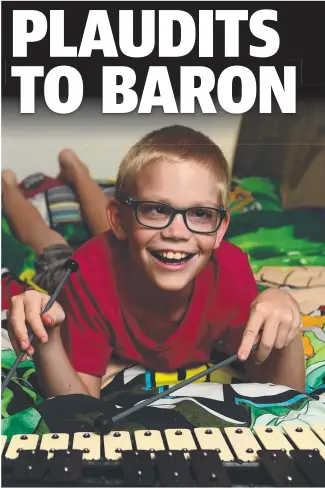  ?? WILLING LEARNER: Baron Scott, 9, at home with his percussion set. Picture: EVAN MORGAN ??