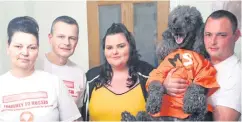  ??  ?? Joint support: Deborah with her partner James Galway, daughter Emma and son Scott and family dog Harvey who’s wearing a campaign T-shirt