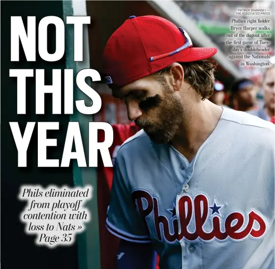  ?? PATRICK SEMANSKY — THE ASSOCIATED PRESS ?? Phillies right fielder Bryce Harper walks out of the dugout after the first game of Tuesday’s doublehead­er against the Nationals in Washington.