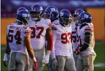  ?? PATRICK SEMANSKY — THE ASSOCIATED PRESS ?? Giants linebacker Blake Martinez (54) huddles with Dexter Lawrence (97), Trent Harris (93) and Jabrill Peppers (21) last week. Martinez leads the NFL with 92 tackles.