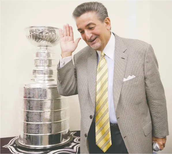  ?? — GETTY IMAGES FILES ?? Washington Capitals and Wizards owner Ted Leonsis, seen superstiti­ously shielding his eyes as he walks past the Stanley Cup, hopes to soon launch sports betting in Capital One Arena during games. He believes gambling will attract a new wave of fans.