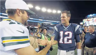  ?? ASSOCIATED PRESS ?? TWO GOOD: Tom Brady and Aaron Rodgers will square off Sunday night.