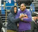  ?? JERRY JACKSON/BALTIMORE SUN ?? Carmelo Anthony stands with his son, Kiyan, on the sideline as the Ravens warm up before a game at M&T Bank Stadium. Carmelo announced his retirement from the NBA on Monday.