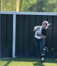  ?? Bud Sullins/Special to the Herald-Leader ?? Siloam Springs right fielder Allison Hooks throws the ball in after a Russellvil­le triple off the bat of Taylor Kilgore during the second inning of Monday’s game at La-Z-Boy Park. Russellvil­le defeated Siloam Springs 10-0 in six innings.