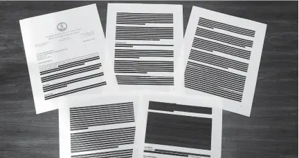  ?? SARAH RANKIN/AP ?? Heavily redacted documents from Virginia’s Office of the State Inspector General, addressed to Brian Moran, Democratic Gov. Ralph Northam’s secretary of public safety and homeland security, and provided to The Associated Press in response to an open records request are displayed in October 2020 in Richmond. The OSIG has found new problems with victim and prosecutor notificati­on in cases handled by the state parole board, according to other documents provided Tuesday to lawmakers.