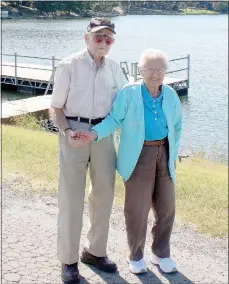  ?? Keith Bryant/The Weekly Vista ?? Harold Hussman, left, walks with his wife, Jacquelin Hussman during the couple’s daily exercise. They walked across the Lake Avalon Dam, enjoying the breeze and the clear sky on a warm September Monday.