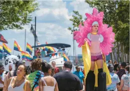  ?? ?? A performer on stilts walks in the crowd at PrideFest 2022.